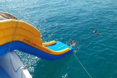 2.5 hour Glass Bottom Boat Trip, Snorkeling, Sliding and Fun - The long swim and snorkeling window: fish, clear water, and a snack break