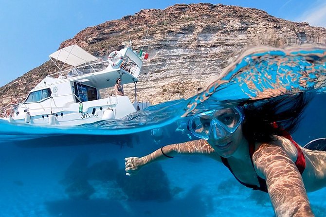 7 hours Boat trip to Lampedusa lunch, SUP and Snorkeling - Marine-reserve beach views when the north wind helps