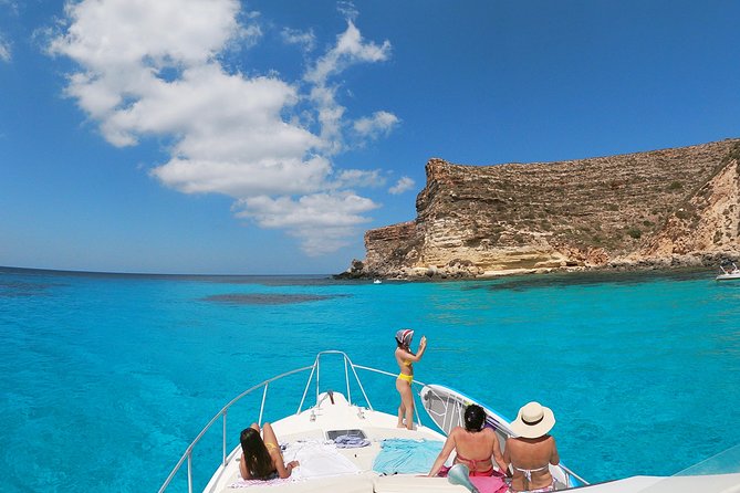 7 hours Boat trip to Lampedusa lunch, SUP and Snorkeling - The quick port moment and the Lampedusa migration monument