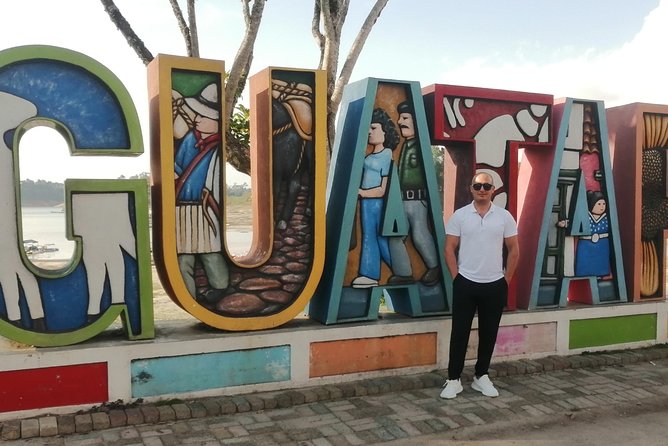 Amazing Private Guatape Tour + Boat Ride + Helicopter & Rock - Malecón de Guatapé: Two Hours of Waterfront Stories and Easy Wandering