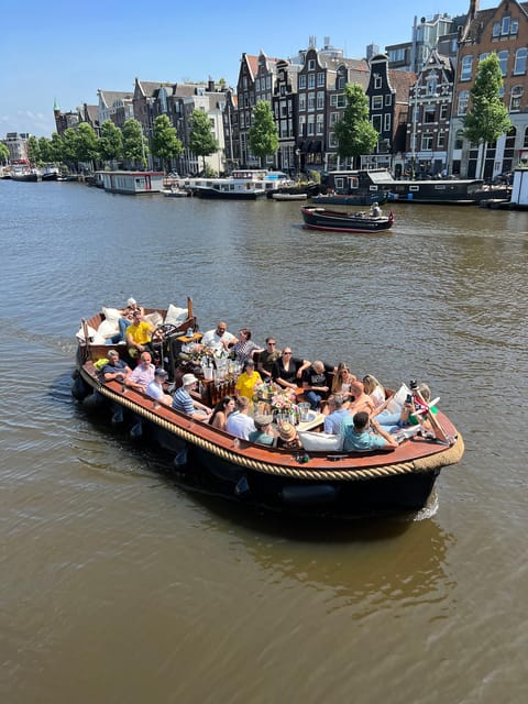 Amsterdam: Boat Tour with Optional Unlimited Drinks - Rembrandt House and Sint Antoniesluis: the ride feels personal here