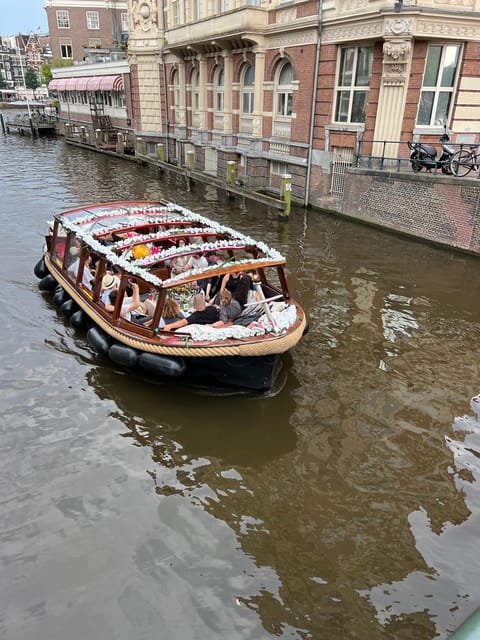 Amsterdam: Boat Tour with Optional Unlimited Drinks - Sea Palace, Grand Hotel Amrâth, and the canal-hotel stretch