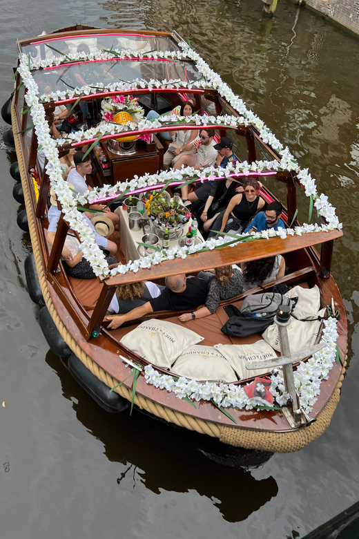 Amsterdam: Boat Tour with Optional Unlimited Drinks - Montelbaanstoren to De Sluyswacht: tower-and-tunnel vibes from the water