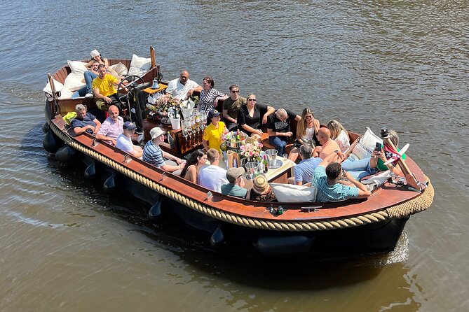Amsterdam Luxury Boutique Boat tour with Unlimited Beer and Wine - Passing Rembrandt’s house years: seeing the address behind the name