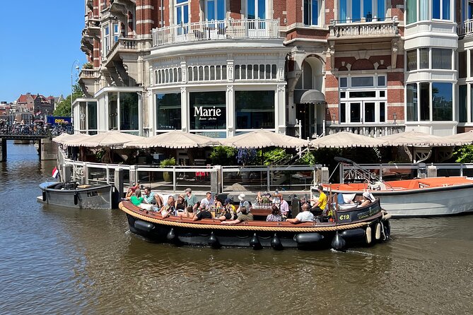 Amsterdam Luxury Boutique Boat tour with Unlimited Beer and Wine - Magere Brug, the Skinny Bridge, and why couples love it