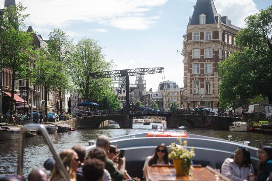Amsterdam: Open Boat Tour of Canals with Expert Local Guide - Magere Brug From the Water: The Bridge Moment You’ll Remember