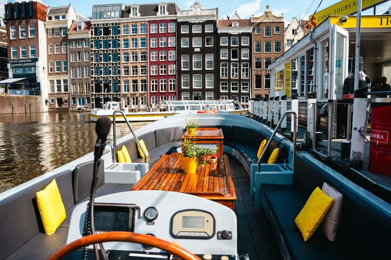 Amsterdam: Open Boat Tour of Canals with Expert Local Guide - Timing, Seasons, and Weather: What to Plan For March–October