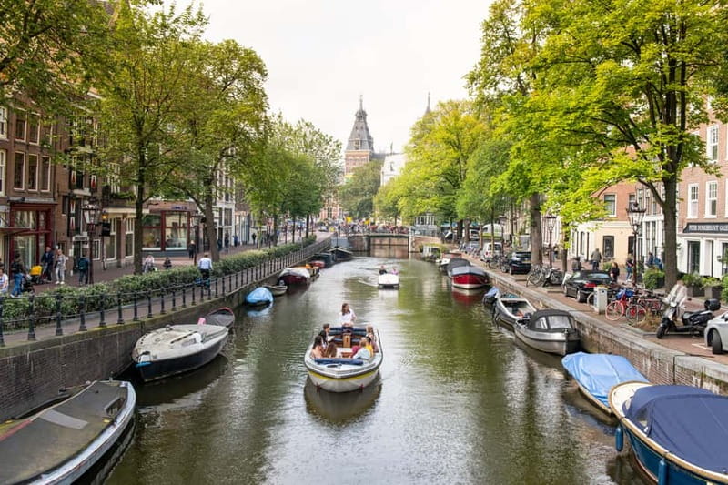 Amsterdam: Open Boat Tour of Canals with Expert Local Guide - Choosing Your Start Point: Damrak 22, Rijksmuseum, or Prins Hendrikkade