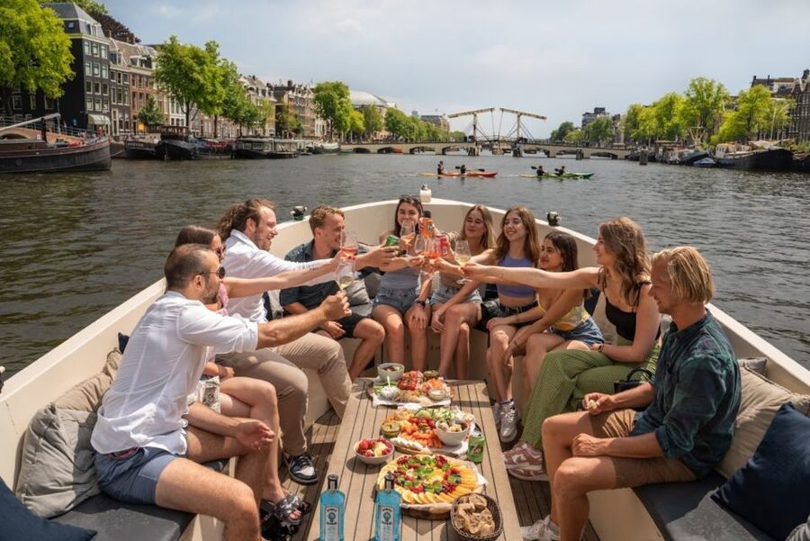 Amsterdam: Red-Light District Pub Crawl and Booze Boat Tour - Drinking Games, Prizes, and Why the Structure Matters