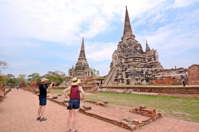 Ayutthaya Sunset Tour: UNESCO Temples & Peaceful River Cruise - Fruit market browsing and the snacks you actually get