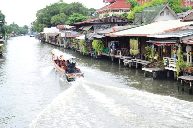 Bangkok Floating Markets and Boat Tour - Boat paddling on Bangkok’s klongs: local houses and kids’ Thai music