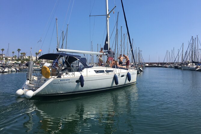 Barcelona 3-hour Private Boat Trip - Maremagnum and Port Vell: Columbus statue and a Ramblas-style waterfront view