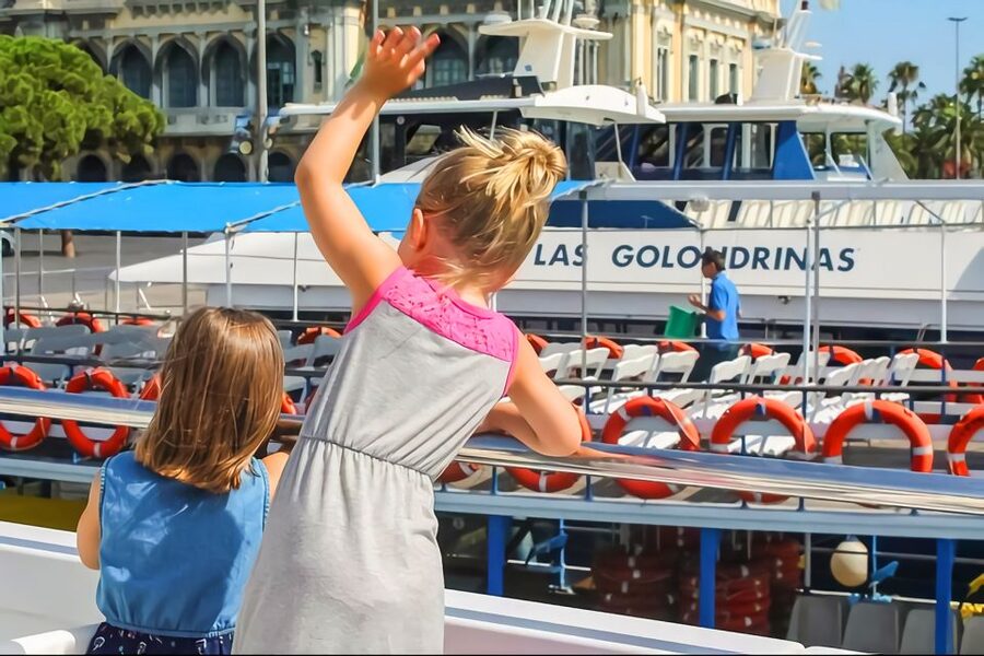 Barcelona: Boat Tour in Las Golondrinas - Getting On the Water by the Colón Monument