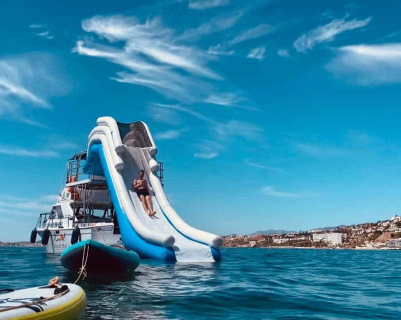 Benalmádena Boat Tour with Snorkeling, Water Slide and Lunch - Dolphin watching: the crew looks, not just waits