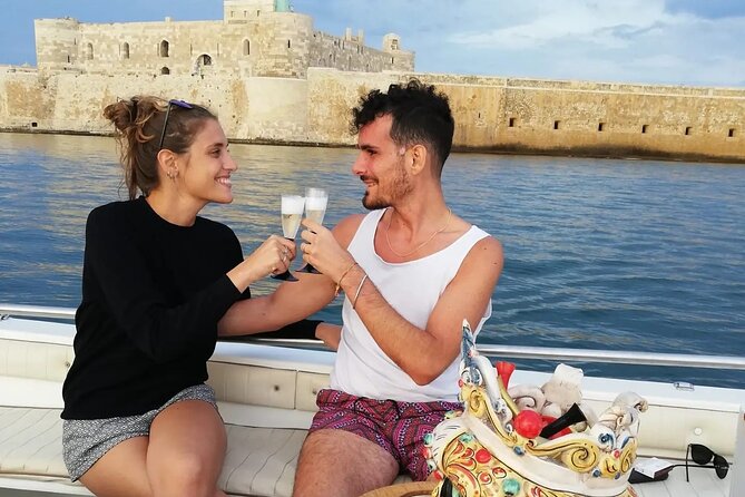 Boat tour of Ortigia, sea caves, Pillirina and snorkeling - Two hours of Syracuse views, with cave time included