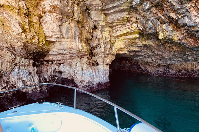 Boat tour of the Polignano a Mare caves with aperitif - Grotta Azzurra: The Light Trick Under Santo Stefano Bastion