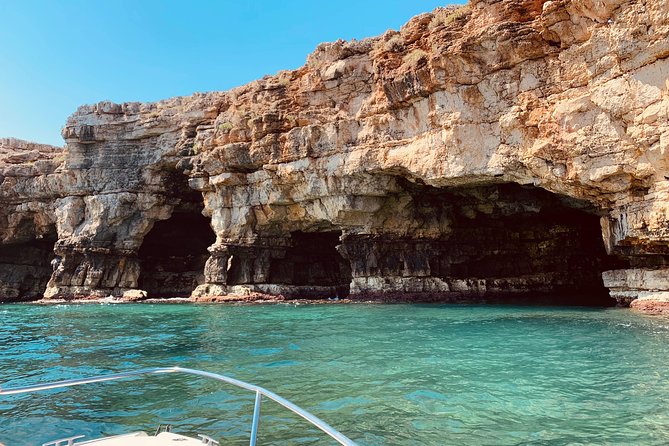Boat tour of the Polignano a Mare caves with aperitif - Lama Monachile and the Domenico Modugno Viewpoint