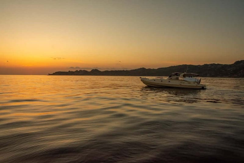 Bonifacio: Sunset Aperitif Dining Boat Tour - From Main Port to the Calanque of Fazzio: Swim, Paddle, and Reset