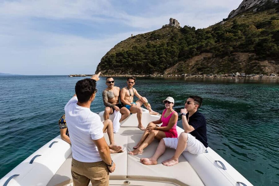 Cagliari: Boat Tour with 5 Snorkeling Stops & Free Drinks - Sella del diavolo: swimming time with dramatic coastline vibes