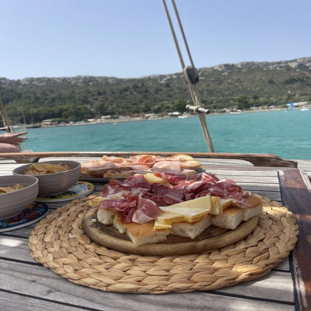 Cagliari: Boat Tour with Swim Stops, Snorkeling, & Aperitif - A Traditional Gozo Boat Day Starts at Marina Piccola