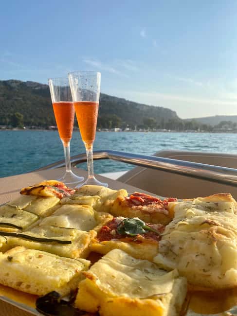 Cagliari: Sunset Boat Tour with Aperitif and Prosecco - Poetto and the best swim spot: clear water at the right moment
