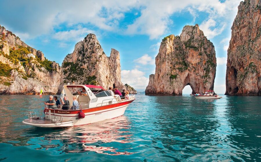 Capri: Full-Day Small Group Boat Tour - Faraglioni and the “light show” grotto area: the main reason to choose a boat day