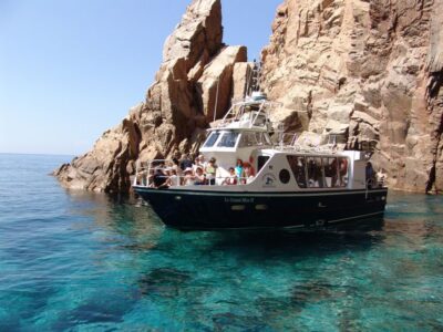 Cargèse: Scandola, Girolata, and Piana Afternoon Boat Tour - Capo Rosso: caves, an arch, and that signature red rock