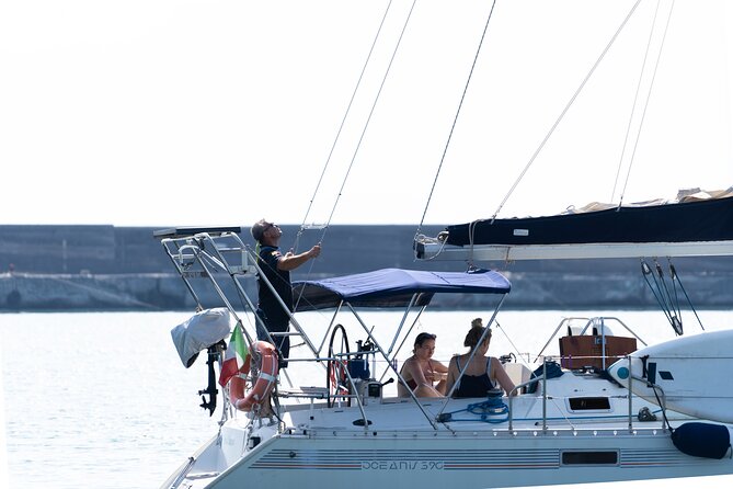Catania boat tour along the coast with aperitif and snorkeling - Stop 2: Aci Trezza—coastline views with a little drama
