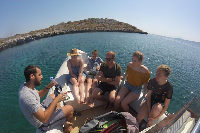 Chania: Boat Trip with Guided Snorkeling Tour & SUP - Entering the water from Chania: pickup, meeting point, and timing