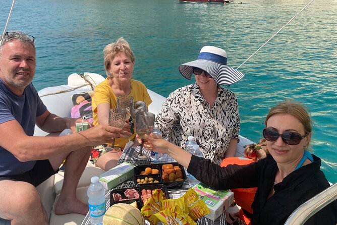 Chiara boat tour in dinghy, stops, snorkeling, aperitif included - Stop 1 Poetto: Promenade Views and the Dolphin Maybe