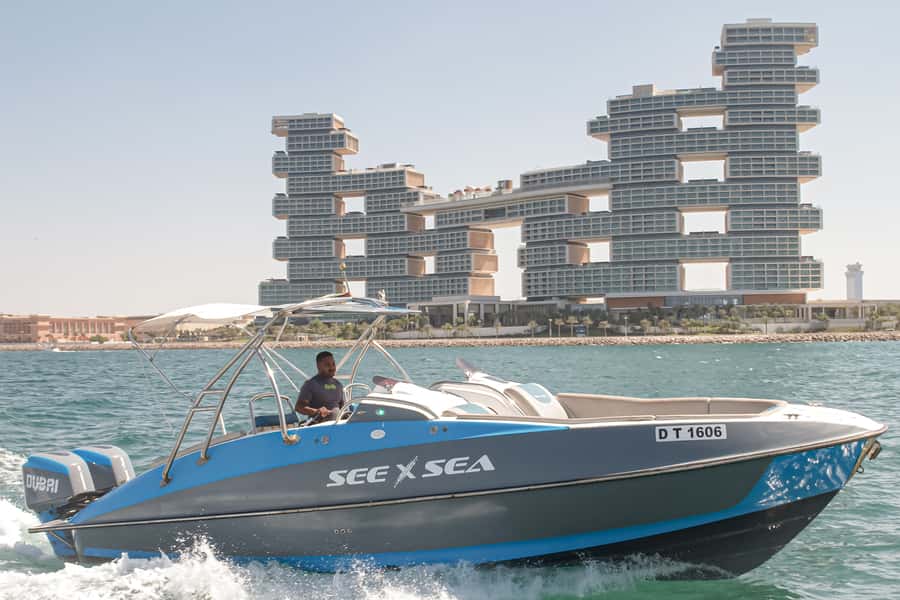 Dubai: Private Luxury Night Boat Tour - Entering the experience at Dubai Marina Pier 7