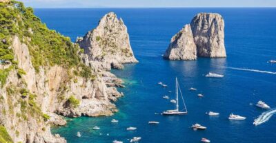 From Amalfi: Day Trip to Capri Private Boat Tour with Drinks - Amalfi Coast views on the way to Capri: Sirenuses and Li Galli