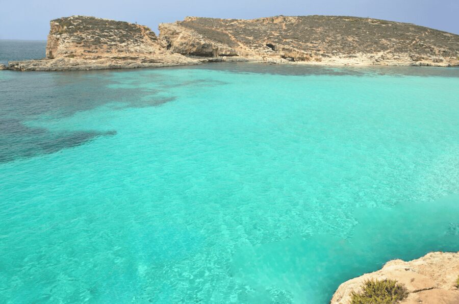 From Malta/Gozo: Comino & Crystal Lagoon Private Boat Trip - First Stop: Sea Caves and a Fast Photo Break on Comino
