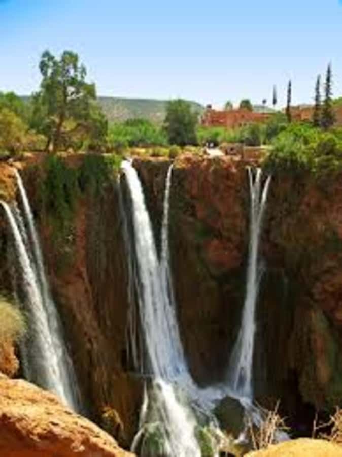 From Marrakech: Ouzoud Waterfalls Guided Hike and Boat Trip - Entering Ouzoud by olive groves and an argan co-operative stop