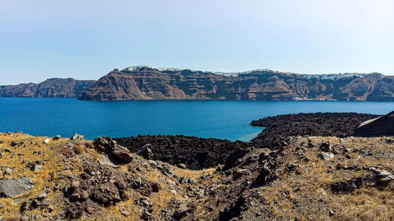 From Old Port:Volcanic Islands Boat Trip & Hot Spring Visit - Palea Kameni hot springs and mud baths: warm water that depends on the month