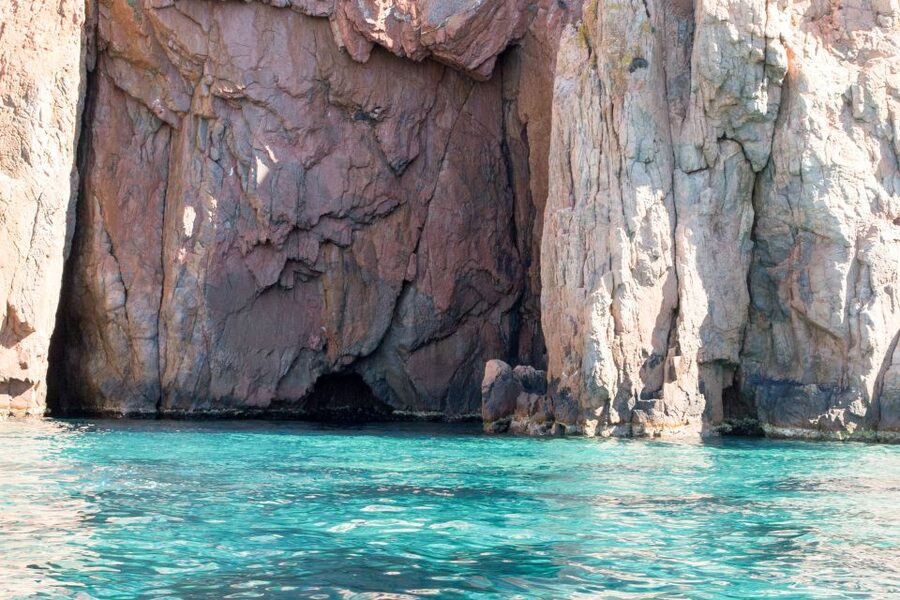 From Porto: Boat tour to the Calanches of Piana & Capo Rosso - Capo Rosso: the natural arch and the view of the Genoese tower
