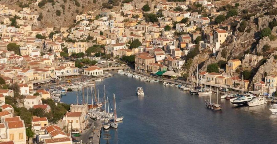 From Rhodes: Boat Trip to Symi Island with Hotel Transfer - The guide matters: German narration and a few familiar names