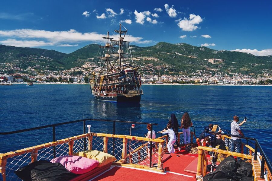 From Side: Alanya Tour with Lunch, Boat Trip, and Cable Car - Harbor cruise from Alanya: Red Tower views plus pirate-cave names
