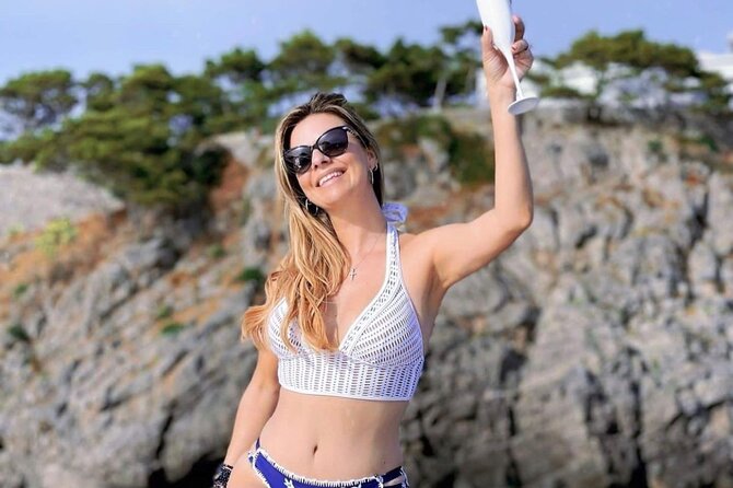 Full day Private Capri boat tour from Positano - Faraglioni time near Marina Piccola: Stella, Mezzo, and Scopolo