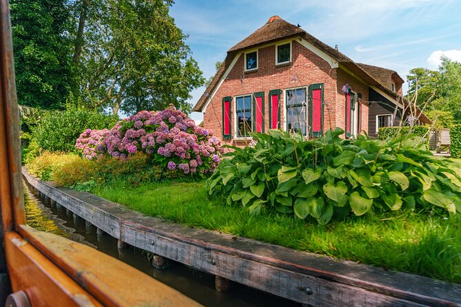 Giethoorn and Afsluitdijk Day Trip from Amsterdam with Boat Trip - Afsluitdijk Photo Stop: Dutch Water Engineering in One Windy Moment
