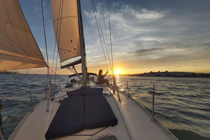 Golden Hour Boat Tour - Sailing by the Monuments with Wine - Where you start: Doca de Santo Amaro and the feel of the cruise