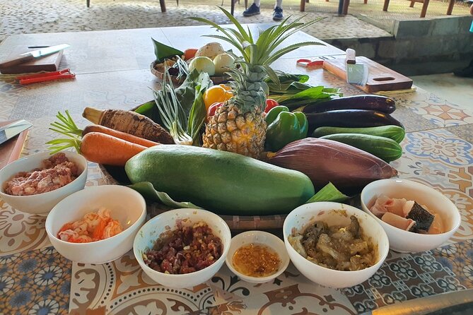 Hoi An Cooking Class With Market Tour and Bamboo Basket Boat Ride - Lunch in a garden setting: what you’ll eat and why it’s a highlight