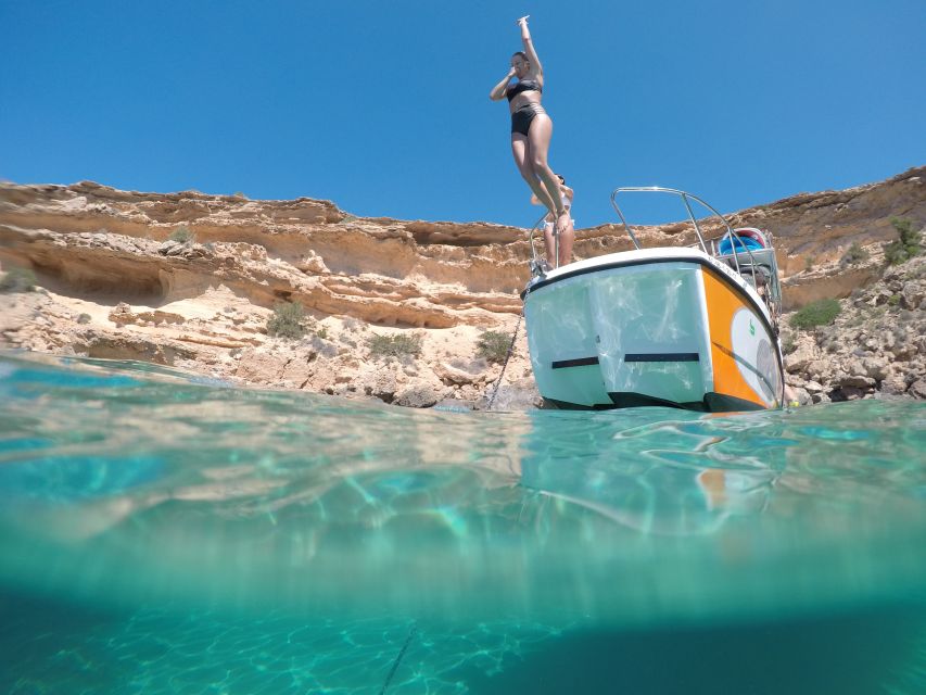 Ibiza: SUP & Snorkel Boat Tour with Caves, Drinks & Photos - The tasty middle of the trip: aperitif, fruit, tapas, and cold drinks