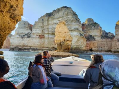 Lagos: Guided Ponta da Piedade Sunset Boat Tour - The grottos: Cathedral, Kitchen, Living Room, and Skull