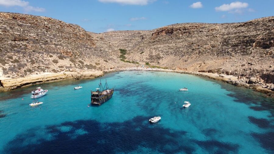 Lampedusa: Pirate Ship Boat Tour with Lunch and Music - Boat Stops Beyond Beaches: Sea Caves and Faraglione Sacramento