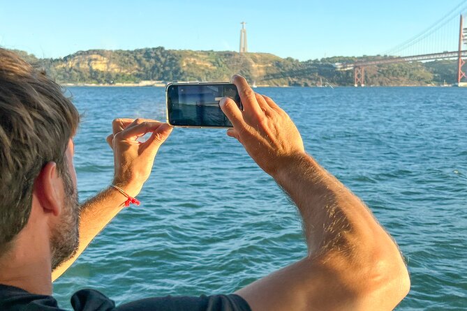 Lisbon Boat ride on Tagus river - Christ the King From the South Bank: A Big Statue Moment