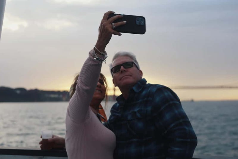 Lisbon: Sunset Boat Tour with Music and Drinks - Cristo Rei viewpoint energy: seeing Lisbon’s height from the Tagus