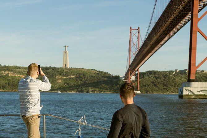 Lisbon : Sunset Catamaran Boat Tour with Music and Drinks - Belém Tower and the Portuguese Discoveries monument from the water