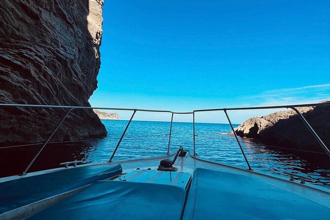 Mallorca Beach & Caves 4hr Boat Trip Drinks, Tapas, SUP & Snorkel - Alcanada Island lighthouse stop: sun time plus the best part of a snack break