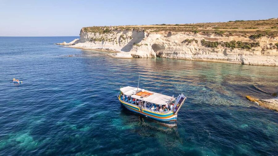 Malta: Sunset Boat Tour to St. Peter’s Pool and South Coast - Salt pans and Marsaxlokk Lighthouse: seeing work along the shore